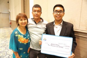 Robert Jomar Malate poses with his parents Roberto and Maria Teresa Malate at the Saipan Chamber of Commerce meeting at the Royal Taga Hall of the Saipan World Resort last July 7. (BEA CABRERA)