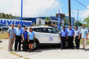 Triple J officials and Hotel Association of the Northern Mariana Islands team members pose with the HANMI Golf Tournament hole-in-one prize, a 2017 Hyundai Tucson GL. (Contributed Photo)