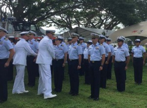 Capt. James Pruett and Capt. Christopher Chase conduct a uniform inspection of Coast Guard Sector Guam crewmembers during a change of command ceremony at Naval Base Guam, July 7, 2017. ( U.S. COAST GUARD/LT. J.G. IIA MILLER)