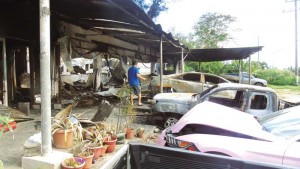 At least eight vehicles went up in flames when a fire of still unknown cause swept through an auto repair and tire shop along Chalan Pale Arnold Road in Puerto Rico. (Ferdie de la Torre)