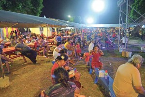 The audience listens to performers at the 2017 Liberation Day festivities. (Erwin Encinares)