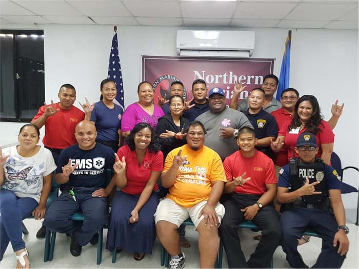 The CNMI University Center for Excellence in Developmental Disabilities at Northern Marianas College held a training workshop for representatives of the Department of Public Safety, Department of Fire and Emergency Services, and Department of Community and Cultural Affairs on Rota. Photo includes participants from DCCA, DPS, DFEMS, as well as ASL instructor Ivyanne Ealy, Martin Mendiola (NMC-Rota director), Jennifer-Eilleen E. Castro (UCEDD program manager), and Floyd R. Masga (UCEDD director). (NMC)