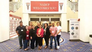 Superior Court Associate Judge Teresa Kim-Tenorio, fourth from right, and Superior Court Drug Court coordinator TaAnn T. Kabua, at Kim-Tenorio’s right, pose with other members of the drug court. (Contributed Photo)
