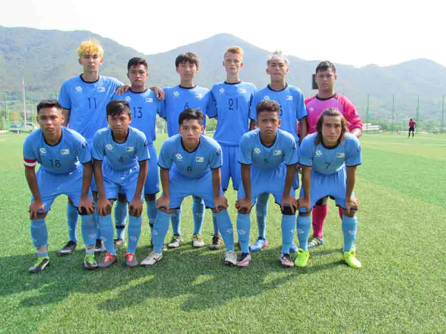 The CNMI Boys U18 National Team’s starting 11 pose for a photo before playing against Japan’s Kunimi High School last Monday at the Changnyeong Sports Park in South Korea. (Contributed Photo)