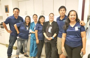 Family Care Clinic head nurse head Abbys Mitchell, third from right, poses with CORE volunteers. (Bea Cabrera)