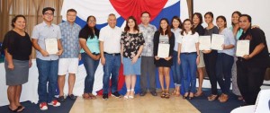 TanHoldings Corp. executives led by president Jerry Tan, third from left, join participants of the 2nd Annual TanHoldings Summer Internship Program in yesterday's completion ceremony at Kanoa Resort's Latte Stone Hall. (Jon Perez)