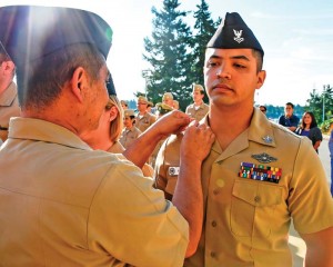 Hospital Corpsman 1st Class Edward Brice Sablan is ceremoniously frocked on July 14, 2017, under the Meritoriously Advancement Program, to his current rate. Add the Fleet Marine Force qualification pin he received on the same deployment that he was cited for the Purple Heart and his uniform shows accomplishments that speak volumes. (MCS1 GRETCHEN M. ALBRECHT/NAVAL HOSPITAL BREMERTON)