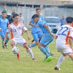The CNMI’s Hark Joshua Galarion, second right, battles a Shonan Institute of Technology player for the ball.