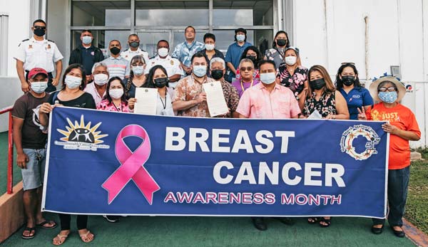 Gov. Ralph DLG Torres and Lt. Gov. Arnold I. Palacios share a photo with members of the Commonwealth Cancer Association