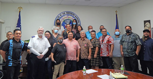 Gov. Ralph DLG Torres and Lt. Gov. Arnold I. Palacios—bottom row fourth and fifth from left— share a photo with representatives