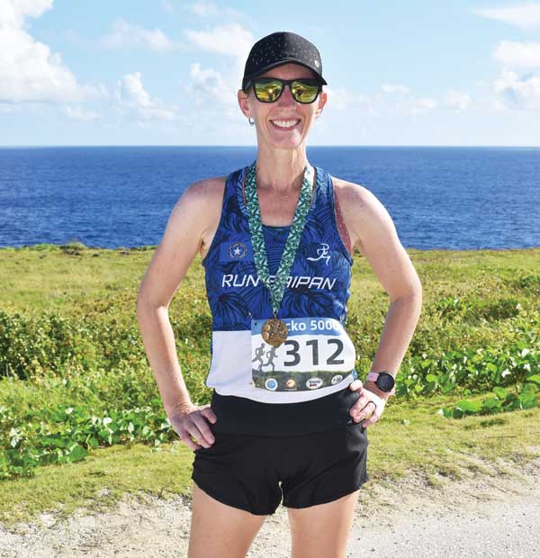 Audrey Christley poses with her first place medal after topping the 6-kilometer cross country race of Saipan International School’s Gecko 5000