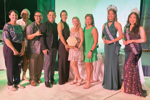 Saipan Community School principal Amanda Dunn receives the award for Environmental Heroes Award on behalf of the Saipan Community School, during Friday’s Green Gala