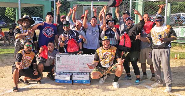 Team Kliq celebrates after winning the championship of the King of the Diamond Labor Day Softball Tournament.