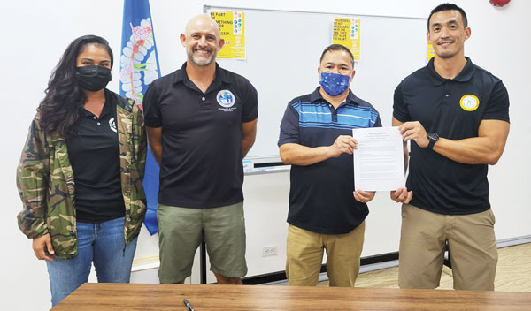Memorandum of agreement signing between the NMIBF and PSS for the 2021-2022 season of the interscholastic basketball competition