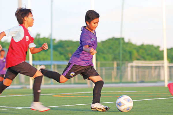A Hopwood Middle School player, right, takes a shot, during their game against Mt. Carmel School.