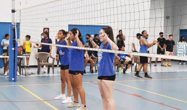 Three Marianas High School 1 players line up at the net during their game against Saipan International School 2