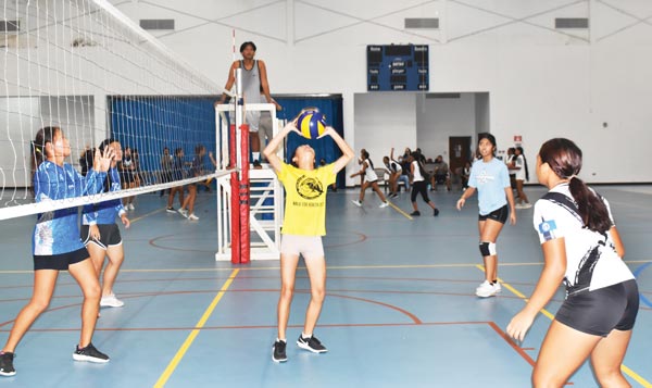 Marianas High School 2’s Sherry Zhu sets the ball against Saipan International School 2