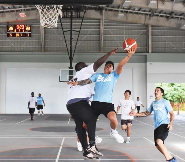 The Game’s Richard McWilliams plays stout defense against Sixers forward Jaymark De Guzman