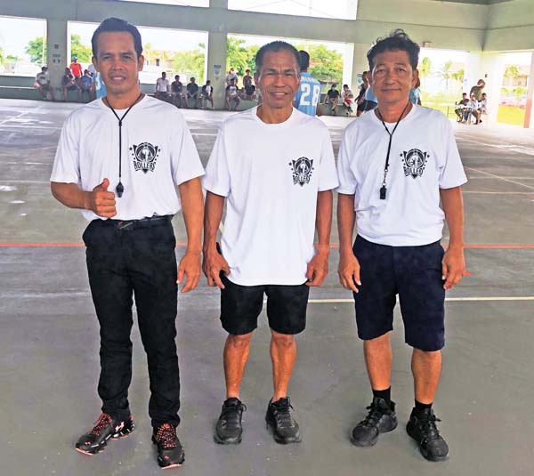 Basketball referee Robert Tamondong, center, is bidding the CNMI adieu today after making the islands his second home since 1991.