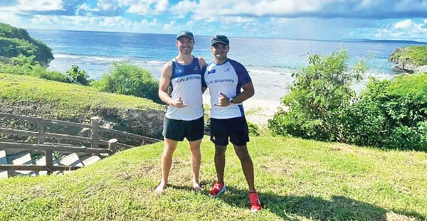 Run Saipan president Edward Dela Cruz Jr., right, poses with Marshall Hoskins after the Run Saipan’s International Coastal Cleanup Day 5K