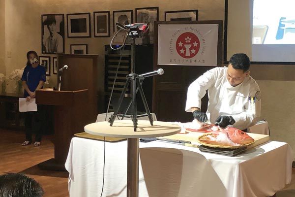 Hyatt Regency Saipan executive sous chef Zen Tomokane demonstrates how to filet an onaga.