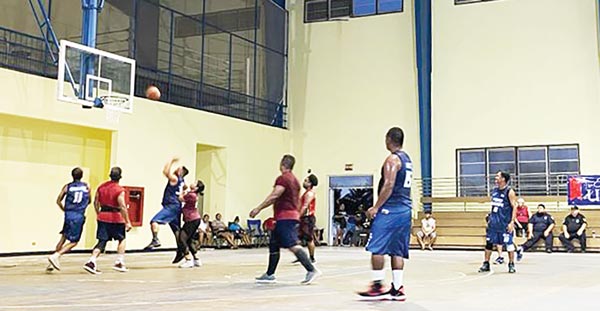 Rampage and Power Builders players in action in the 2021 Island-wide Men’s BudLight Basketball League