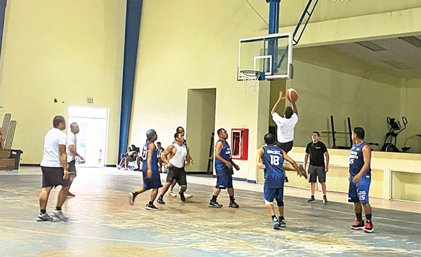 Team Kio’s Matt Dela Cruz goes up for a running shot against Power Builders in their 2021 Island-wide Men’s BudLight Basketball League.
