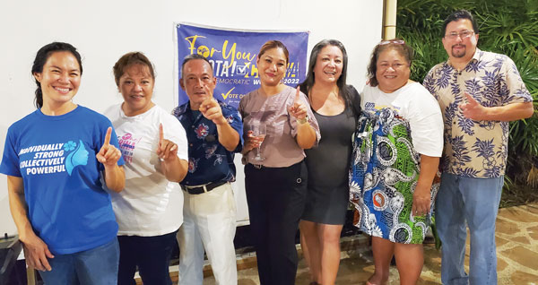 Corina L. Magofna of the NMI Democratic Party, center, poses for a group photo with other Democrat Party lawmakers