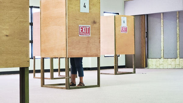 A Precinct 3 resident casts her vote at the Pedro P. Tenorio Multi-Purpose Center in Susupe last Saturday