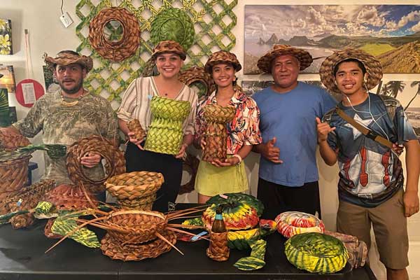 Marianas Creations owner Elina Gharti Chhetri, center, poses with, from left, Nature’s Treasures co-founder/weaver Steven Van Winkle, SaiHi Eats owner Marley Partain, Nature’s Treasures co-founder/weaver Samisoni Pome’e, and Gerald Mamis.