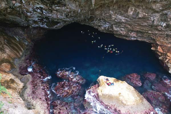 Swimmers are seen enjoying the still waters of the newly rehabilitated Grotto.