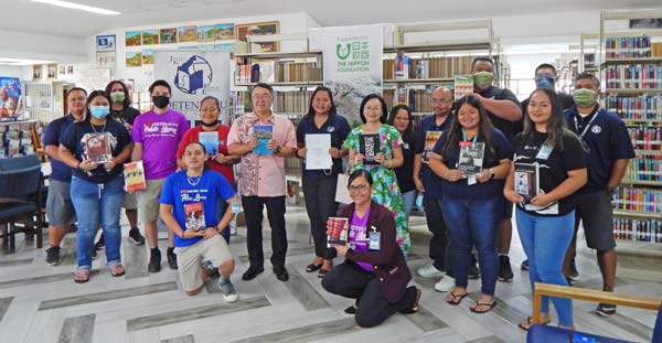 Consul Ono Kazuhiko, seventh from left, from the Consular Office of Japan in Saipan, Joeten-Kiyu Public Library director Erlinda C. Naputi