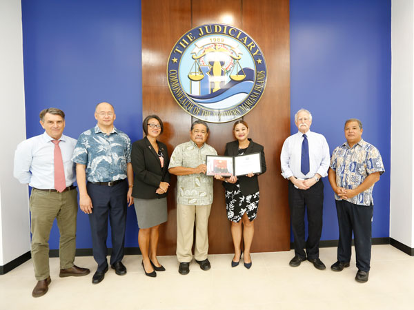 Rep. Corina L. Magofna (D-Saipan), third from right, poses for a photo with CNMI Judiciary justices, judges, and other officials.