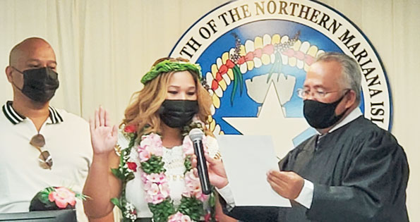 Rep. Corina L. Magofna (D-Saipan) takes her oath of office before Superior Court Presiding Judge Roberto C. Naraja