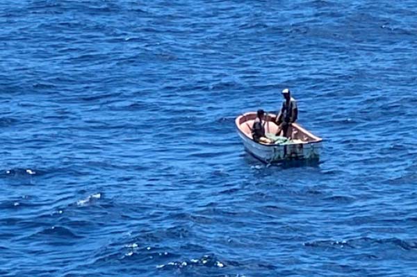 The two I-Kiribati fishermen are seen by the Queen Elizabeth 959. 