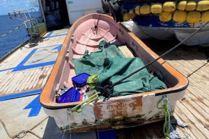 Photographic evidence that the fishing boat was successfully brought onboard the Queen Elizabeth 959. 