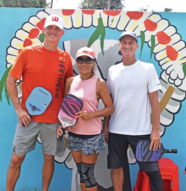 From left, Leith Poole and Marivic and Donn Dunlop pose after finishing in the Top 3 of the first-ever tournament pickleball tournament on Saipan.