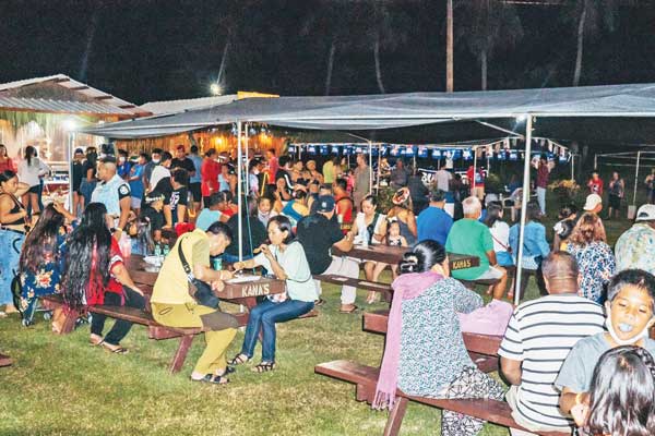 Visitors of last weekend’s “2021 Gineptin Ha’anen Taga Festival” on Tinian sit on benches under tents