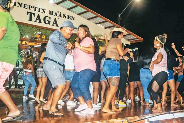 Tinian Mayor Edwin P. Aldan, left, dances on stage during last weekend’s “2021 Gineptin Ha’anen Taga Festival” on Tinian’s.