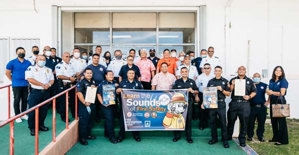 Gov. Ralph DLG Torres and Lt. Gov. Arnold I. Palacios share a photo with Department of Fire and Emergency Medical Services personnel