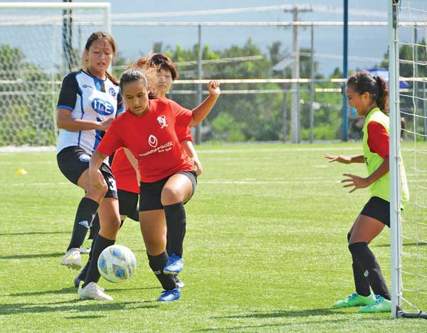 Paire Football Club’s Phoenix Gross deflects the ball for a defensive stop during their game against MP United FC in the girls U15 division of the 2021 NMIFA Youth Fall League