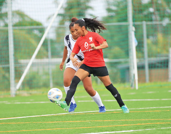 Paire Football Club-2’s Rhonda Gross, right, intercepts a pass intended for Southern United Football Club’s Angellyn Roligat during their Intermediate Division game in the Dove Women’s Fall League 2021 last Oct. 24.