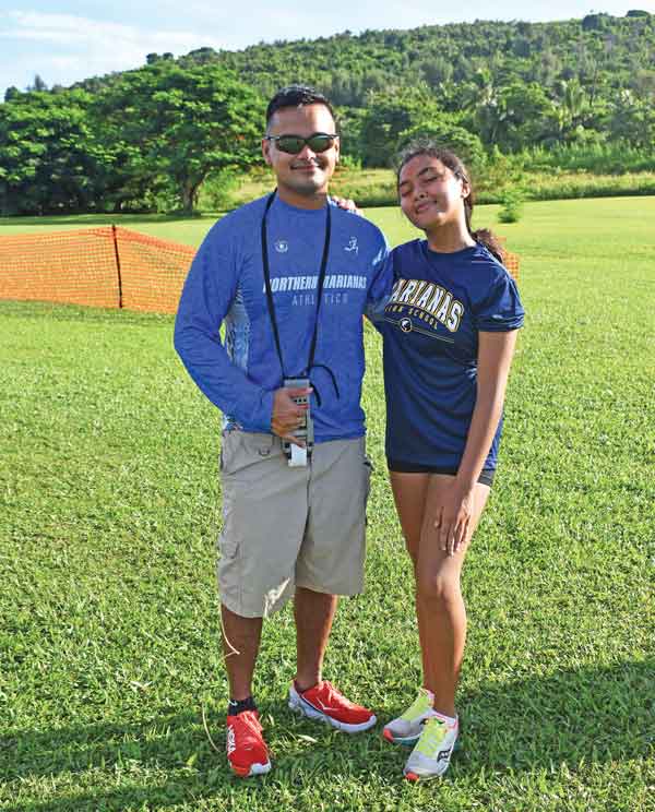 Run Saipan president Edward Dela Cruz Jr. poses with his younger sister