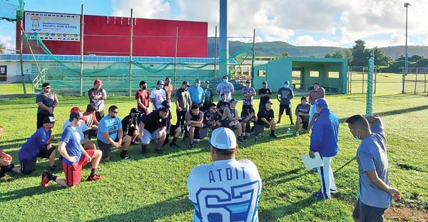 Team manager Manny Sablan and coaches Derron Sablan and Gary Cruz brief players