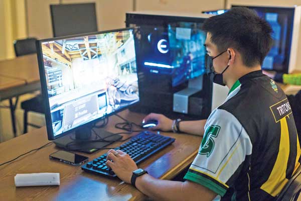 Triton Esports student athlete Phillip “QUE” Quenga competes in a Valorant tournament. 