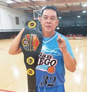 Bogs Dayrit shows off his WWW-style championship belt and ring