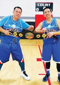 Bogs Dayrit, left, with childhood friend Gerry Cadua.