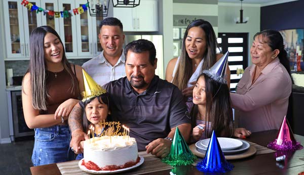 A family celebration scene in the Calvo’s Insurance Count On Us For Life TV commercial.