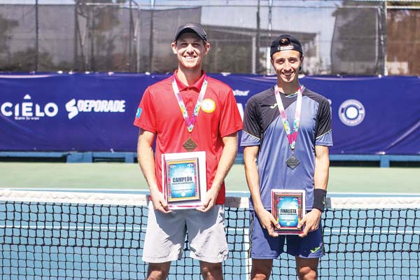 The CNMI’s Colin Sinclair, left, and Italy’s Marco Brugnerotto are all smiles during the awards ceremony