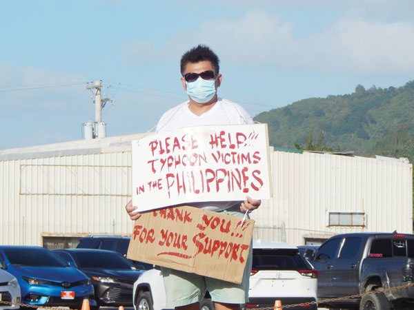 CNMI United Filipino Organization volunteers conduct a donation drive 